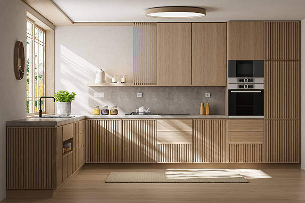 Minimalist kitchen interior in Japandi Scandinavian style featuring matte pine wood cabinetry with vertical grooves, soft gray counter-top, and a clean open layout. Natural light from large windows enhances the warm textures and serene atmosphere, ideal for countryside villas, penthouses, or modern apartment renovations. Perfect for real estate presentations, interior design portfolios, or lifestyle visuals focused on calm functionality and organic material harmony.