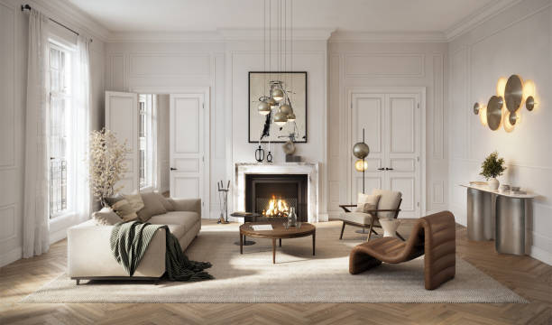 Stylish living room showcasing a comfortable beige sofa, warm fireplace, and sleek lighting fixtures. The soft tones and large windows enhance the modern, airy ambiance.